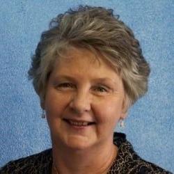 a portrait photograph of Catherine Parish smiling at the camera